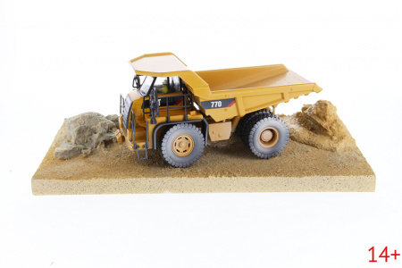 85756 Масштабная модель самосвала Cat 770 Weathered с атмосферными воздействиями "в работе"  в масштабе 1:50